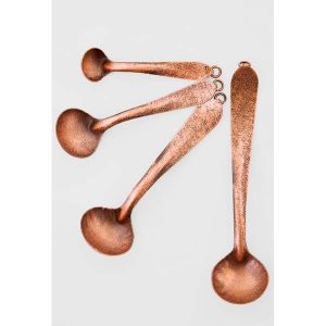 Set de cuatro cucharas de cobre