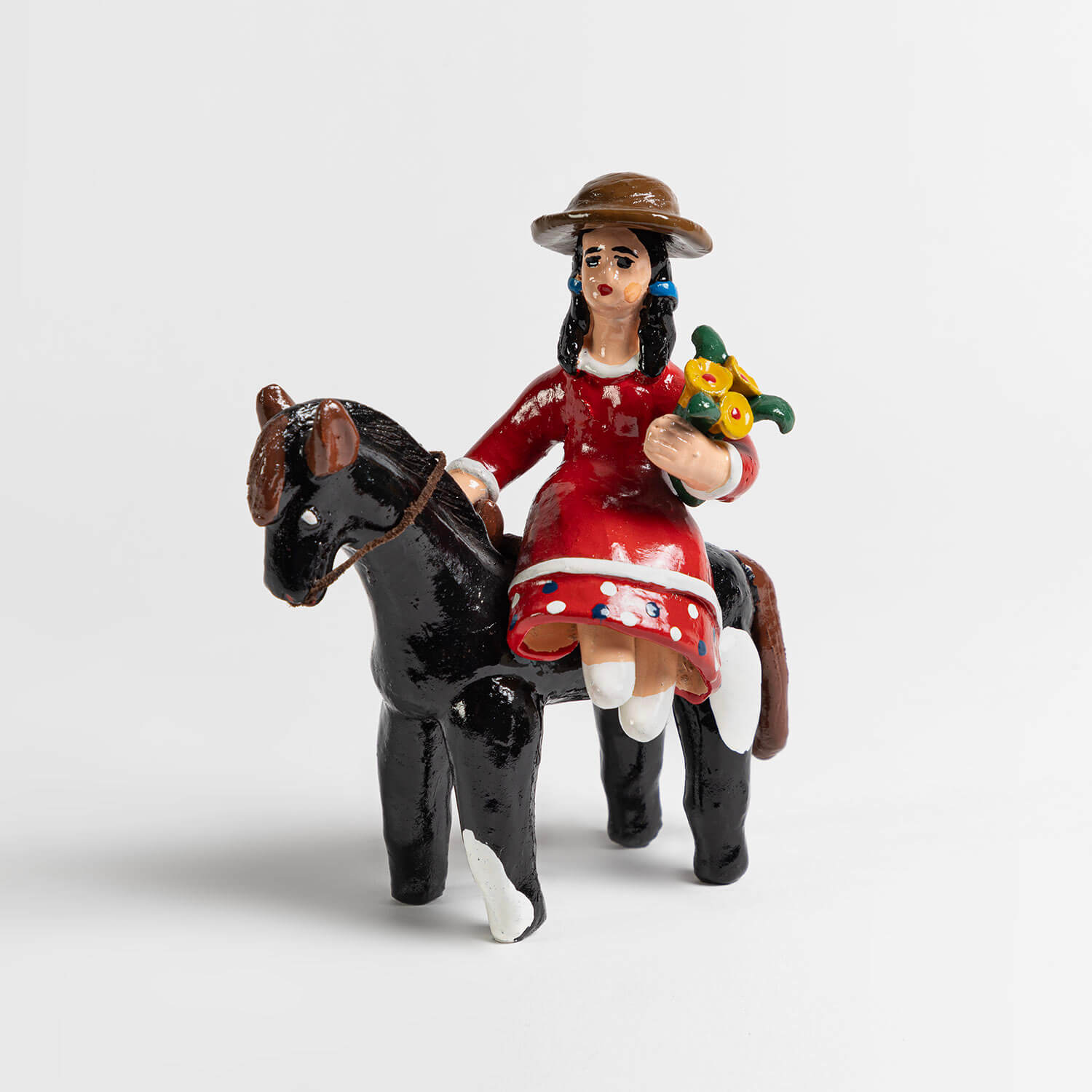 Campesina a caballo de loza de Talagante
